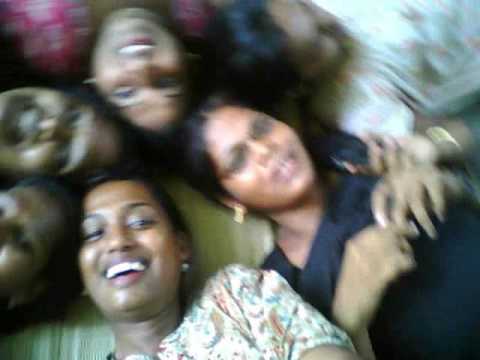 A blurred picture of a group of women lying down together with smiles on their faces