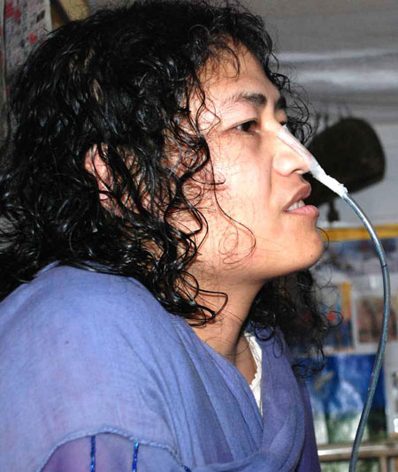 A picture of activist Irom Sharmila, with an oxygen pipe stuck to her nose.