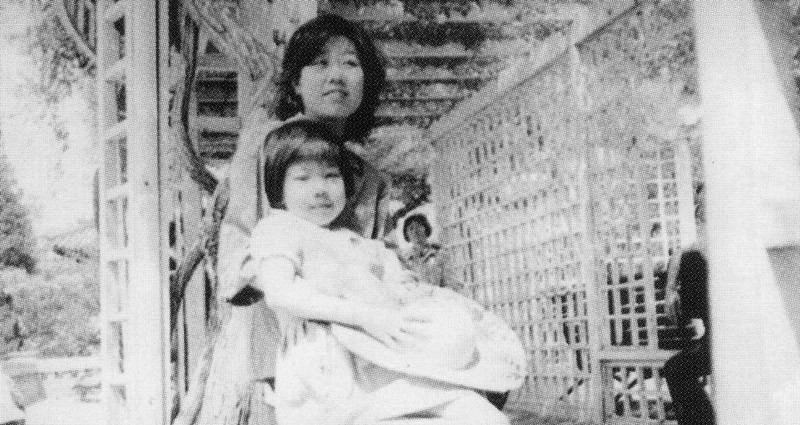 Black-and-white photo of a chinese mother with her child