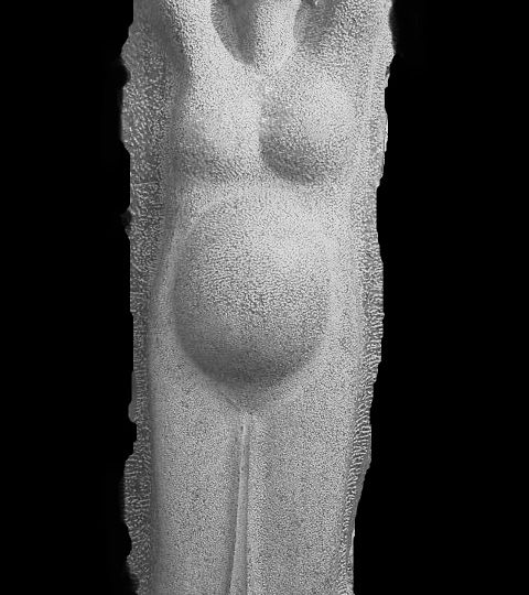 A cement sculpture of the female body