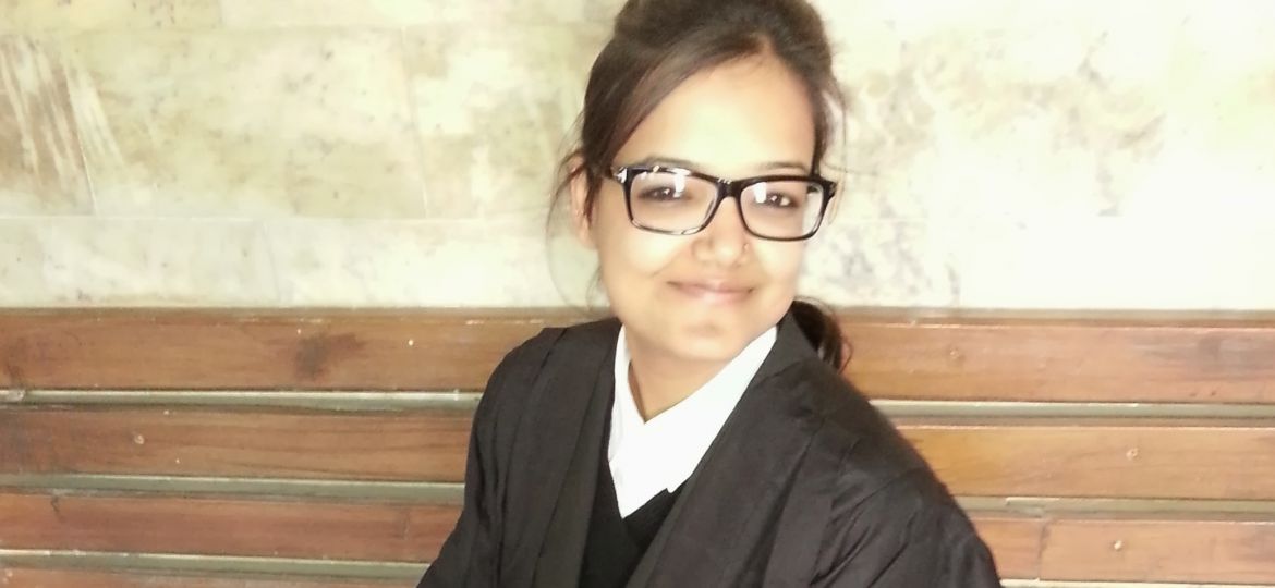 Picture of a female lawyer. She is dressed in her lawyer's uniform.