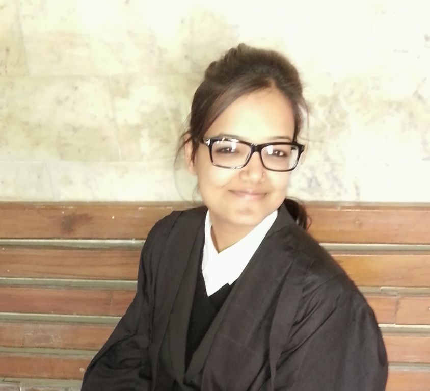 Picture of a female lawyer. She is dressed in her lawyer's uniform.