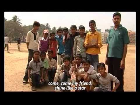 A group of young boys stand in a row, with a few of them sitting down in the front holding cricket bats. the text at the bottom reads, "come, come my friend, shine like a star".