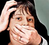 Picture of a child's mouth being covered by a pair of hands