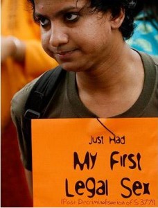 Photo of a female protester holdingup the sign, "just had my first legal sex"