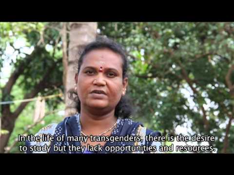 Still from a video. A transgender person in a blue Indian suit and wearing a red bindi, speaking. The subtitle in the video reads, "In the life of many transgenders, there is the desire to study but they lack opportunities and resources."