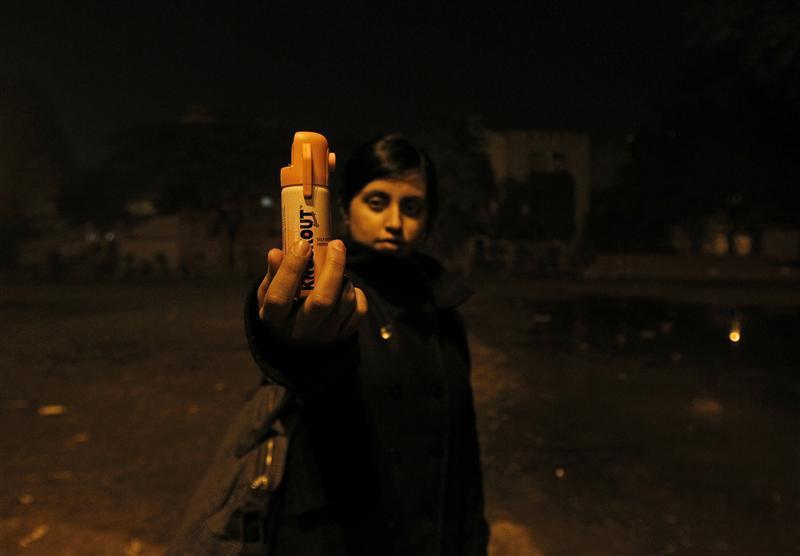 Shaswati Roy Chaoudhary, 23, who works for an online fashion company holds a bottle of pepper spray in a public park in New Delhi