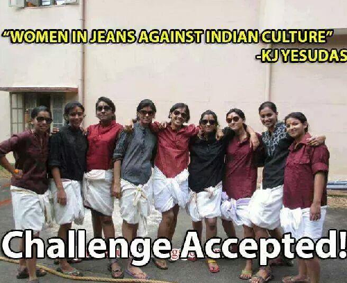 A group of girls wearing knee-length white dhotis, shirts, and goggles, with their hair tied back. "Women in jeans against indian culture - KJ Yesudas" is written opposite the photo. On the bottom is written "challenge accepted".