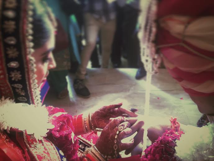 In Plainspeak English Audit In Plainspeak English Audit 100% 10 A Hindu bride placing a ring on the groom's finger. Screen reader support enabled. A Hindu bride placing a ring on the groom's finger.