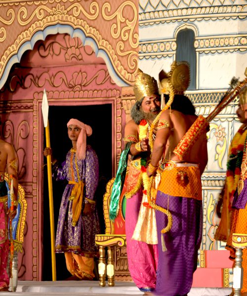 The staging of a Ramleela performance, with actors dressed in costumes representing mythological figures