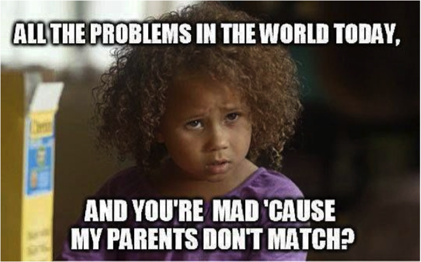 A brunette child with curly hair looks in anger. Over the photo written in bold and caps in white colour, "All the problems in the world today, and you're mad 'cause my parents don't match?"