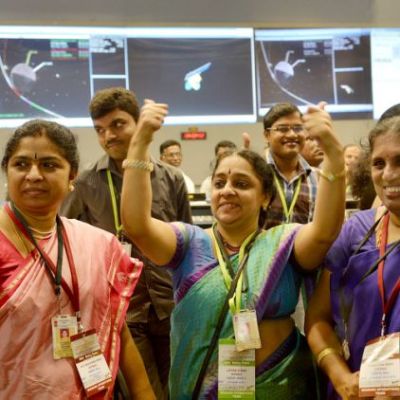 Women scientists at ISRO cheering over Mangalyaan’s success by giving a thumbs-up.