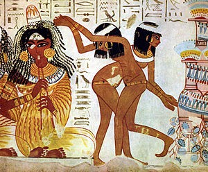 DRESSING AND SEXUALITY: Women entertainers perform at a celebration in Ancient Egypt; the dancers are naked. Thebes tomb c. 1400 B.C. | Credit: Wikipedia