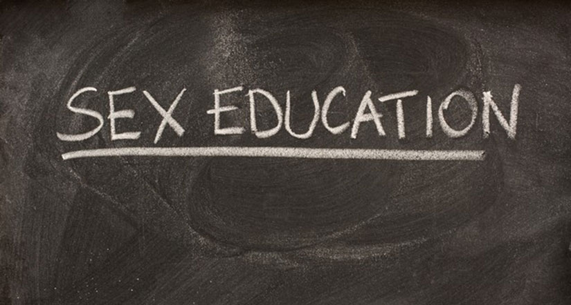 "Sex education" written with white chalk on a black board. It is in all caps and underlined.
