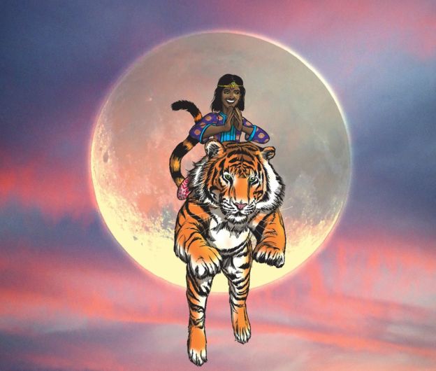 A dark-skinned girl riding a tiger. They are in air as the tiger takes a leap - with the Sun right behind them. The sky is orange-blue as in sunset or sunrise.