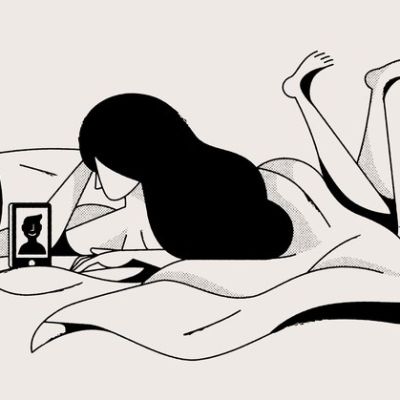 Its a doodle image of a girl lying on her bed and talking to a guy on videochat n her phone.