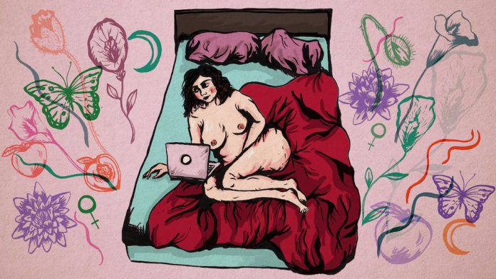 The photo shows a girl slying naked in her bed looking at her laptop. The backgorund of the photo features feminst symbols, flowers and butterflies.