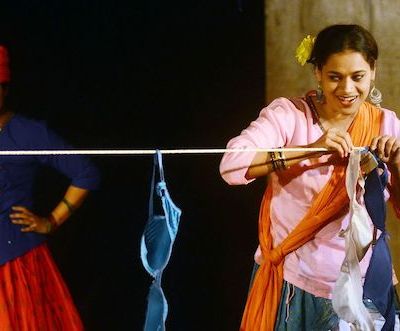 Theres are two photos which are stills from the play,Dohri Zindagi. In thr first photograph, there are two women,one is impersonating a man and the other woman is drying out her laundry (bras), she has a sunflower in her hair. In the second photograph the same women are holding eachother and facing eachother. The third photograph is a still of Vijaydan Detha from his documentary.