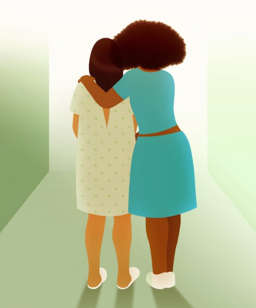 Two women standing facing their backs,side-hugging eachother. One is wearing a hospital gown, has long hair. The other woman has brown curly hair, is wearing a blue dress.
