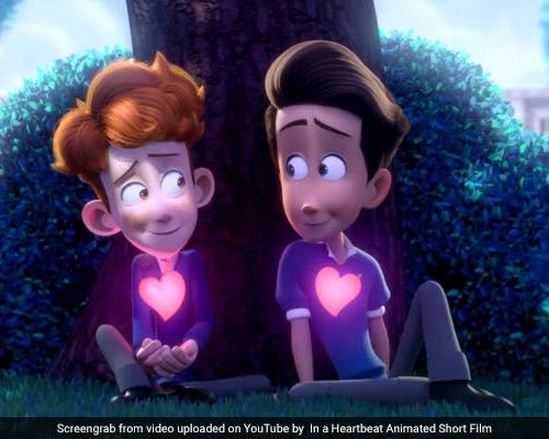 Still from an animated video with two small boys sitting by a tree, looking wide-eyed with love at each other.