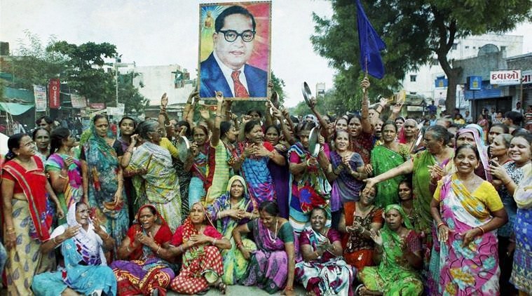 A protest by Dalit women carrying a huge poster of Dr Ambedkar