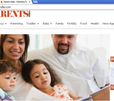 Screenshot of the homepage of the Parents India website. A photo of parents reading to their two kids is visible.