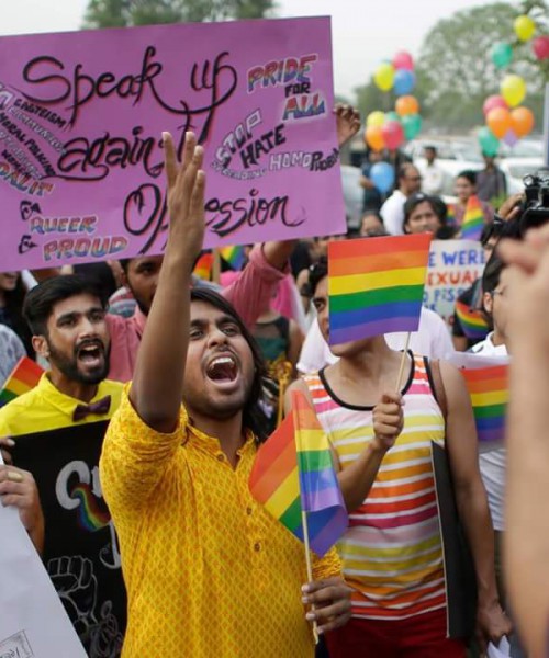 Dhrubo Jyoti shouting slogan at a queer pride march. Someone is carrying a placard "Speak up against oppression".