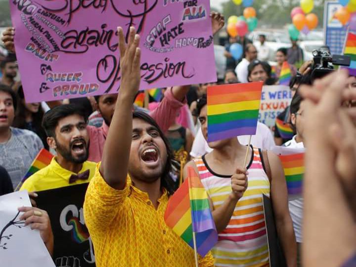 Dhrubo Jyoti shouting slogan at a queer pride march. Someone is carrying a placard "Speak up against oppression".
