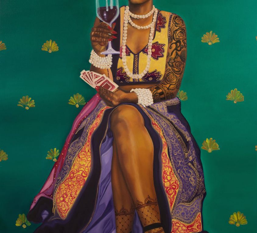 Nimisha Bhanot's painting titled "Money, Kitty Parties & Clothes Is All A Bahu Knows". A brown woman sits on a stool with her legs crossed, red wine in right hand, and cards in the left. She wears a cut-sleeves lehnga; heavy white jewellery in the neck and wrists; and mehndi in hands, full arms, and feet. The lehnga is pulled-up till the knee, showing her legs. She weas a bindi, a nose ring, and a red lisptick, and is staring straight-ahead expression-less.