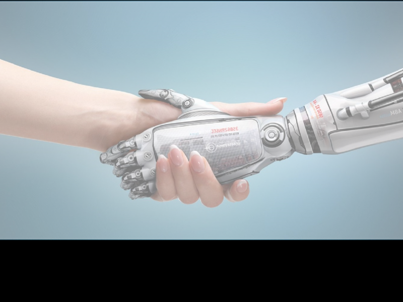 A human and a robot shaking hands. Only see the hands and arms of both is seen.