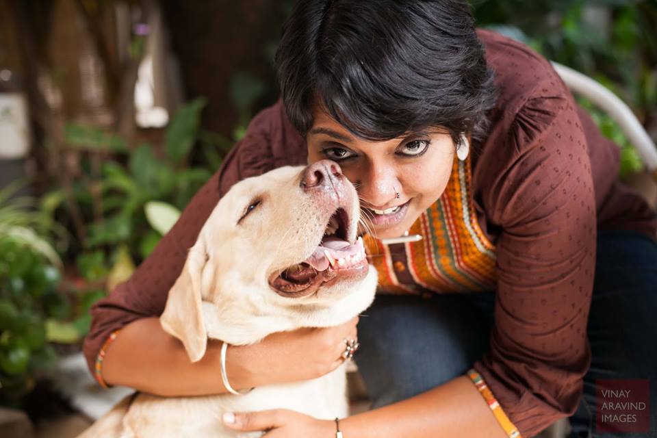 A photo of the author of the piece, Anoopa Anand, with her dog.