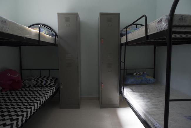 Bunkbeds at the shelter, next to the lockers that house the women's personal effects.