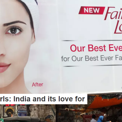 Picture of a woman on a billboard, half of her face is fair-complexion, the other half is dark-complexioned