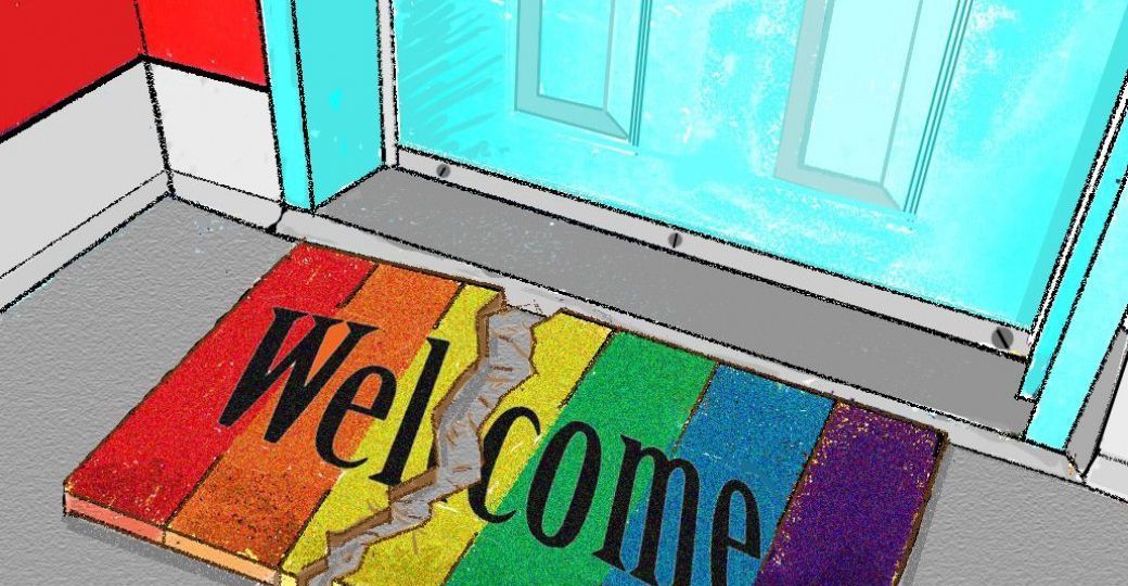 A welcome mat with the rainbow flag on it, it is torn in the middle