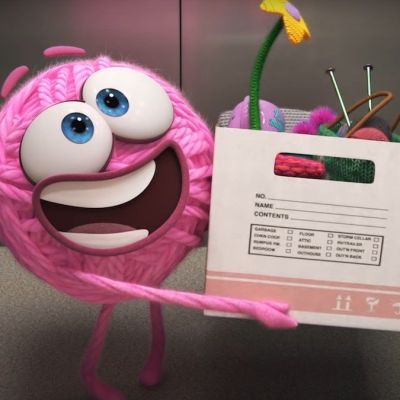 A still from Pixar's 'Purl', showing a smiling pink ball of yarn