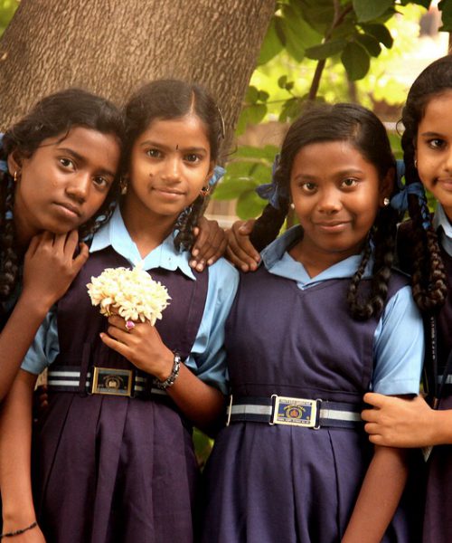 A picture of a group of young girls in school uniform