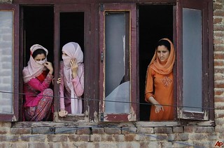 Kashmiri women watching a protest