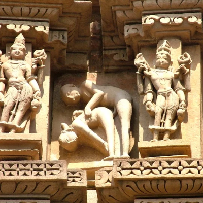 A carving from khajuraho, depicting a sexual position
