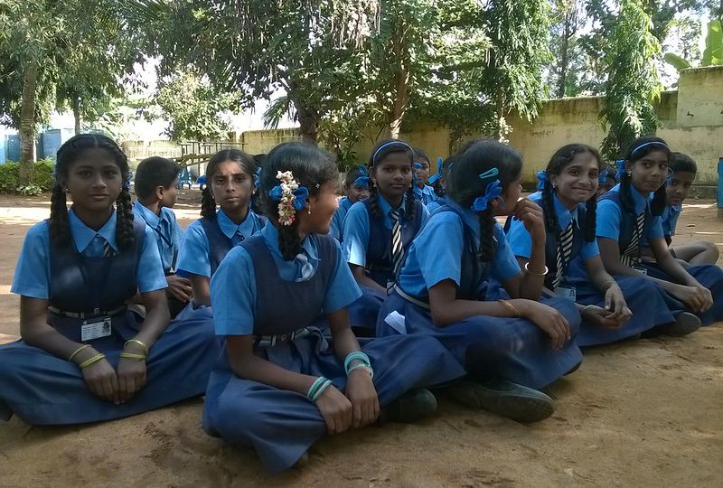 An image showing a group of adolescent girls sitting together