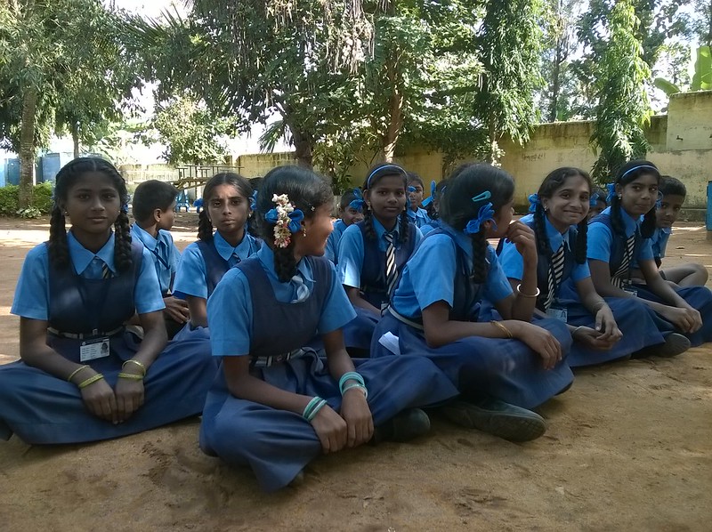 An image showing a group of adolescent girls sitting together