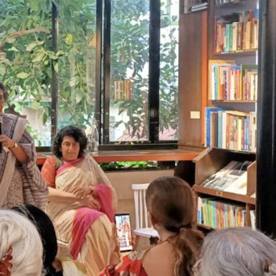 A photograph of Kalpana Sharma, Sharda Ugra, and attendees at an event around the book ‘Single by Choice: Happily Unmarried Women’.