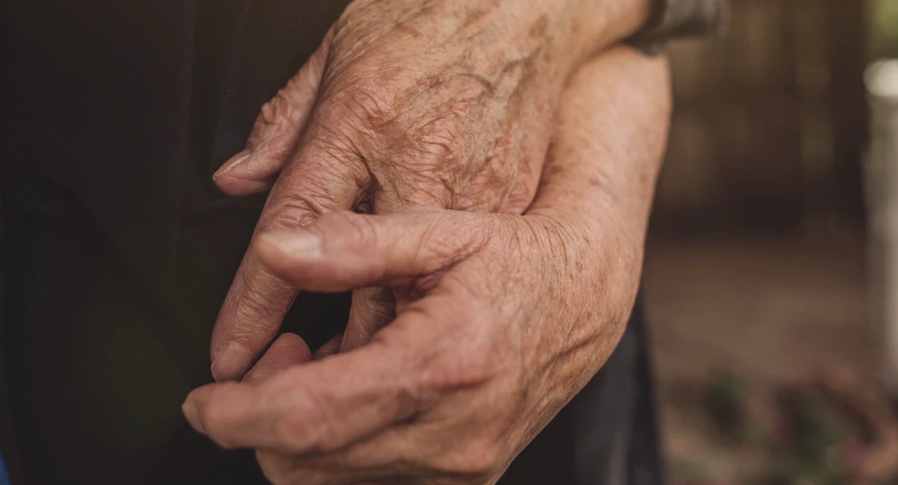 A picture of two hands holding each other