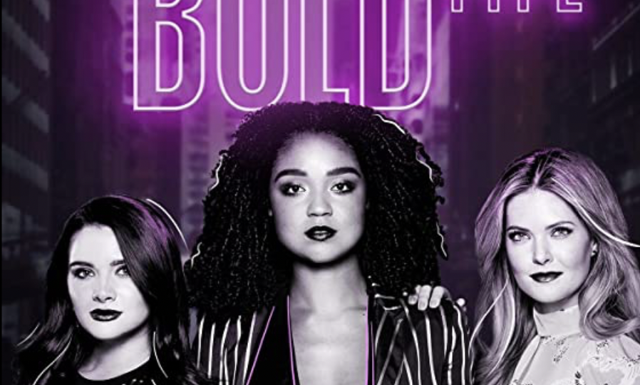 Poster of the Netflix series ‘The Bold Type’ Three girls can be seen standing confidently. On top of the poster, the tile ‘Bold Type is written in purple colour