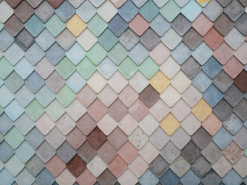 A zoomed-in photograph of a wall with differently coloured flanks.