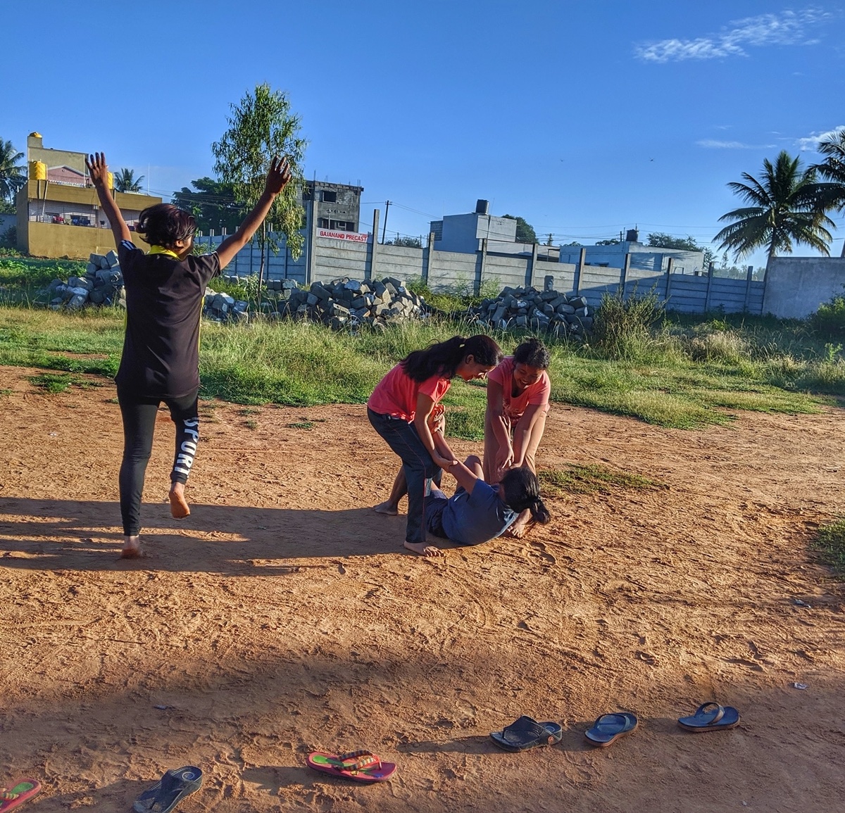 Women At Leisure: Girls playing Kabaddi early in the morning. Rinki jumps in joy as Kajal from the opposition team is taken down by her team members, Ravina and Neelam.