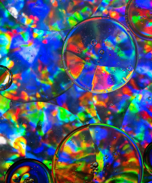 Multicoloured psychedelic circles of varying sizes with tiny bubbles inside
