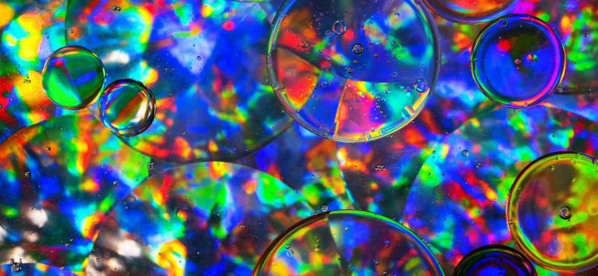 Multicoloured psychedelic circles of varying sizes with tiny bubbles inside