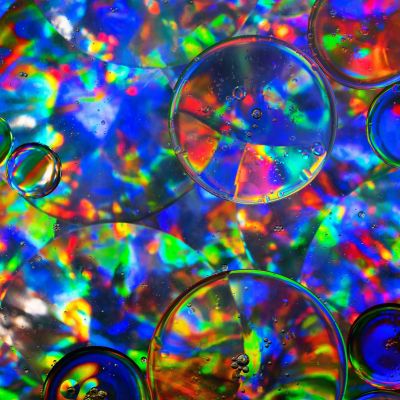 Multicoloured psychedelic circles of varying sizes with tiny bubbles inside