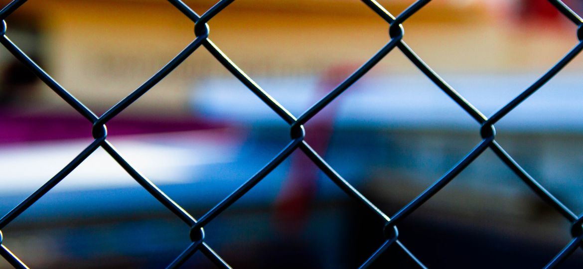 A close-up of chainmesh fencing.