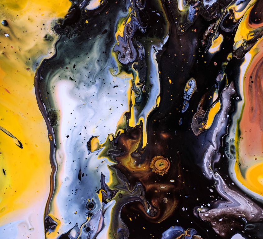 An abstract illustration of swirling patterns and splotches of mustard yellow, black, pale blue, deep orange and pale crimson. The patterns look like galaxies.